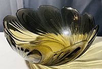 Close-up image of the amber glass fruit bowl showcasing its floral petal shape and textured details.