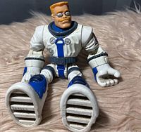 Photo of Warren Waters Rescue Heroes action figure seated, showing the bottom of the feet and front details of the uniform and face.