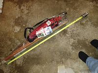 Full view of the hammock chair in original packaging alongside a tape measure indicating approximately 45 inches in length.