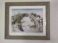 Frontal view of the framed print showing the moongate arch in a natural setting with water and greenery.