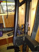 Close-up of black metal frame showing part with Hollywood branding