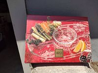 Photo of the Mikasa chip and dip platter set in original box with setup for serving vegetables and dip.