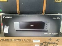 Front view of sealed Canon Pixma Pro9000 box showing full printer image and branding