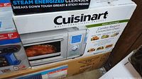 Front of box showing Cuisinart branding, oven image and digital control display