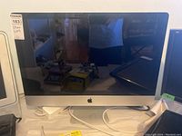 Front view of iMac showing screen, bezel, and stand