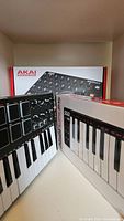 Boxed Akai LPK25, MPK mini and Midimix controllers