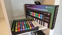 Both Novation Launchpad Mini and Launchkey Mini boxes side by side