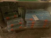 Stack of four Mega 2560 starter kit cases with orange latches