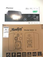 Overview of MouKey Model M20-3 and Pioneer XW-SMA1-K A1 wireless sound system boxes stacked