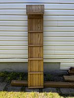 Top view of wooden toboggan showing multiple vertical slats and horizontal reinforcement bars