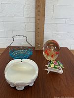 Photo of vintage lot items on table with ruler for size reference, showing glass and porcelain pieces.