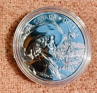 Close-up of the coin's reverse side showing the historic figure in 17th-century attire, sailing ship, and inscriptions.