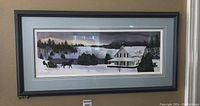 Framed panoramic winter landscape artwork featuring a horse-drawn sleigh and a white house in snow, under a pastel sky.