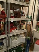 Resin storage shelving unit shown with various items stored on it for size reference, items not included in sale.