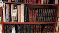 Shelf of various vintage hardcover books including a mix of literary and classic authors.