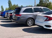 Photo of several parked rental vehicles