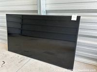 Front view of Samsung TV angled, screen off