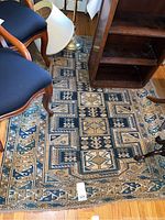 Overall view of flatweave rug showing full geometric pattern and wear spots