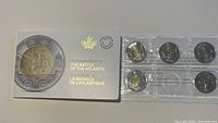 Five 2016 $2 coins in sealed blister pack with Royal Canadian Mint packaging titled 'The 75th Anniversary of The Battle of the Atlantic'