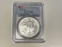 Obverse side of the 2007-W American Silver Eagle coin encapsulated in PCGS graded slab showing Walking Liberty and grading label with First Strike and MS-69 grade.