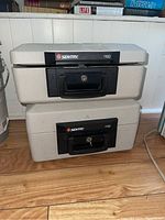 Two Sentry safes stacked, models 1100 and 1150, showing overall size and shape.