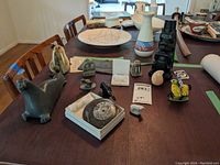 Overview of soapstone and ceramic figures arranged on table