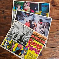 Three stacked lobby cards from 1950s Mexican films showing colorful and black-and-white images and text
