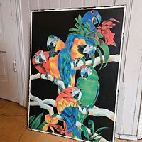 Full view of vintage parrot poster with colorful parrots perched on branches, mounted on wood.