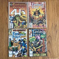 All 4 Fantastic Four comics displayed flat showing front covers clearly