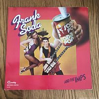 Front cover of Frank Soda and the Imps vinyl LP record showing a man with a double-neck guitar and a woman with a large soda can graphic.