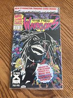 Front cover of the comic book showing superhero characters and title The New Warriors with Marvel branding and anniversary marking 1963-1993.