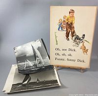 Photo of (10) items consisting of 1950's color book illustration lithograph on easel with text, three nautical photographic prints of sailboats on water stacked and laid down