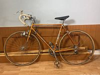 Full side view of the bicycle showing frame, wheels, saddle, handlebars