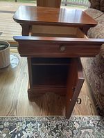 Lexington end table with drawer open and cabinet door open showing shelf interior