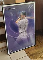 Framed poster featuring baseball player Todd Helton in batting pose with purple background and his name and number 17.