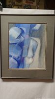 Full view of framed abstract pastel artwork in shades of blue and gray, showing rounded shapes and composition.