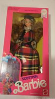 View of full box showing Barbie doll in Scottish dress with packaging text and design