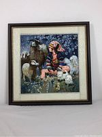 Framed silk embroidery art hung on wall, full view showing image and frame