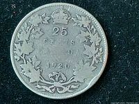 Reverse side showing crowned maple leaf wreath with '25 Cents' and year '1920'.