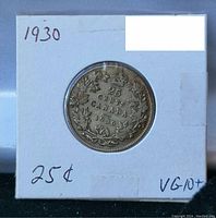Front side of coin showing 1930 date, maple leaves, crown, and denomination 25 cents Canada.