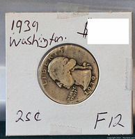 Front view of 1939 George Washington quarter silver coin in 2x2 holder showing obverse with George Washington profile, LIBERTY, date and toning.