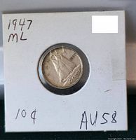Front side of 1947 Canadian silver dime showing Maple Leaf design, labeled AU58.