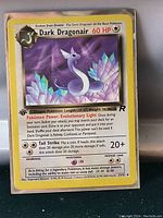 Photo of a near mint high grade Dark Dragonair Pokemon card from the Team Rocket set with 60 HP in a protective sleeve.