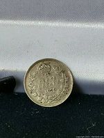 Obverse side of the 1920 Canadian 5 Cent silver coin showing the crown, denomination, date, and wreath design.