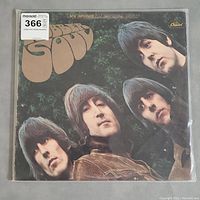 Front cover of The Beatles Rubber Soul vinyl LP album showing the four Beatles and the album title.
