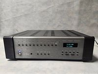 Front panel view showing input buttons, power switch, LCD display and Krell logo