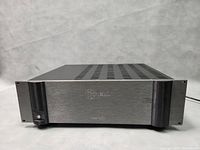 Front angled view of amplifier showing faceplate and feet