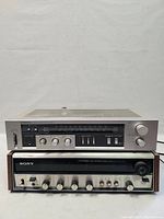 Front view of both stereo receivers stacked: Pioneer SX-303 on top, Sony STR-230 below, showing front control panels and knobs.