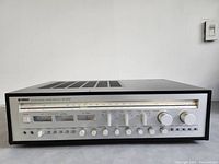 Front view of receiver showing faceplate controls and tuning display