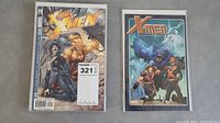 Two comic books shown, an Xtreme X-Men with Wolverine on cover, and an X-Men Millennial Visions comic with multiple characters.